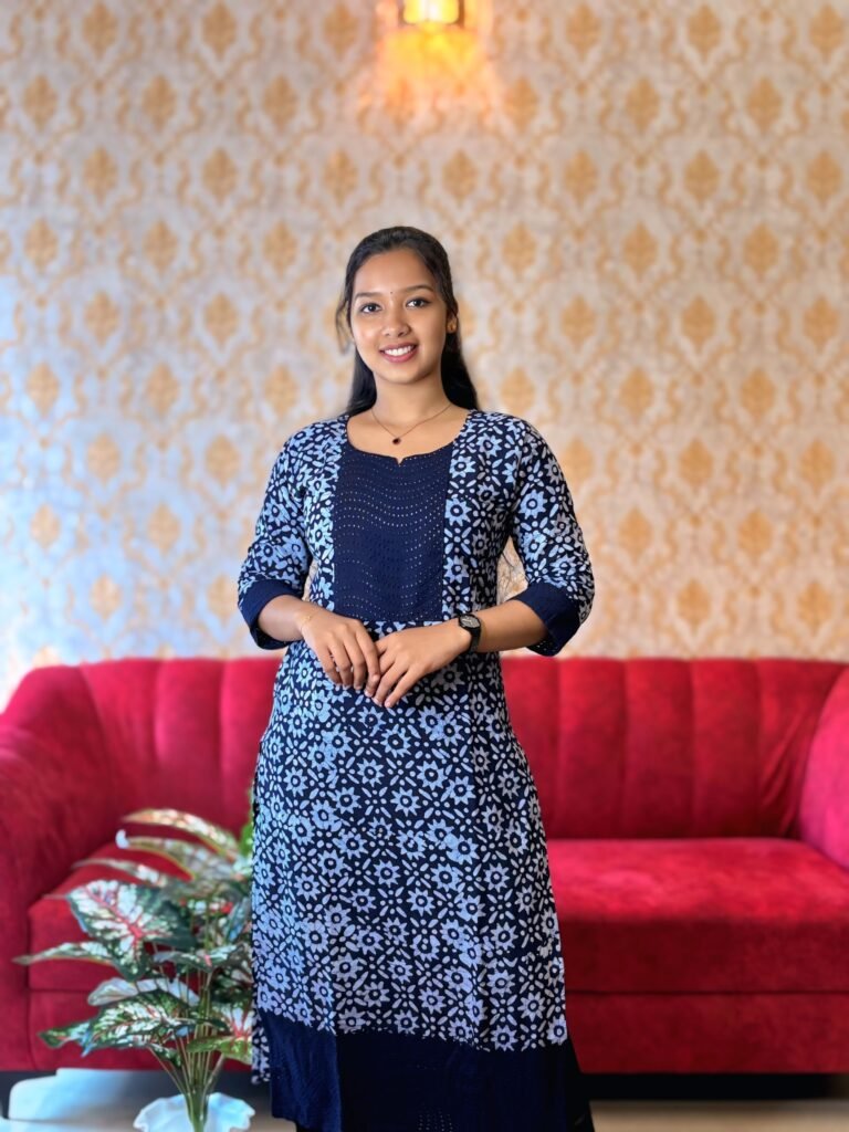 Woman exploring stylish ethnic outfits and designer kurtis during boutique shopping in Kochi at Janki Design, a modern women’s fashion store offering curated clothing collections.