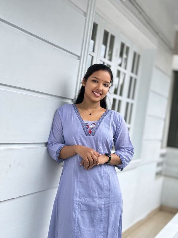 Elegant red bridal blouse with intricate hand embroidery crafted at a boutique in Kochi. Perfect fit and fine detailing for every bride.
