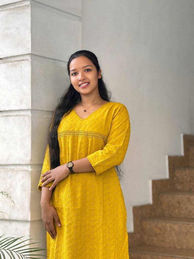 Tailor creating beautifully fitted outfits for women with expert custom stitching services in Kochi.