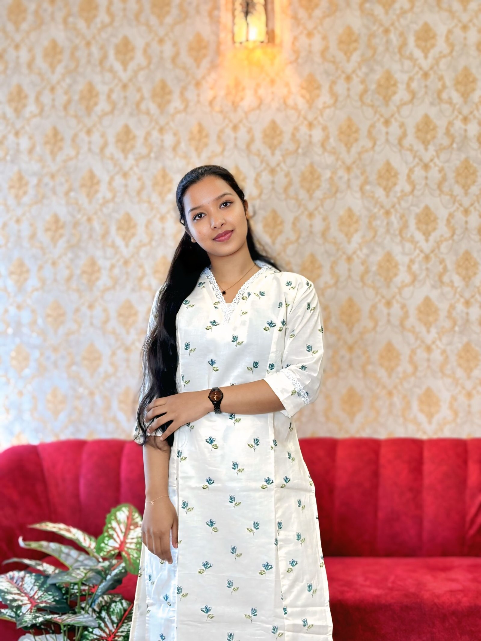 A woman wearing a beautifully designed ethnic outfit from Janki Design, an ethnic wear boutique in Kochi known for handcrafted elegance and modern style.