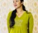 Designer working on custom tailored dresses in Kochi, creating elegant outfits with perfect fit and fine detailing.