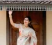 Kerala traditional saree in pastel cream with floral detailing – Janki Design, Kochi.