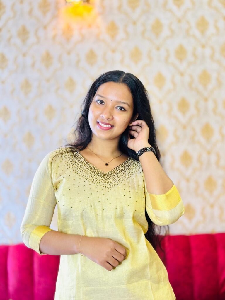 Bright yellow kurti with elegant green embroidery – Janki Design Kochi.